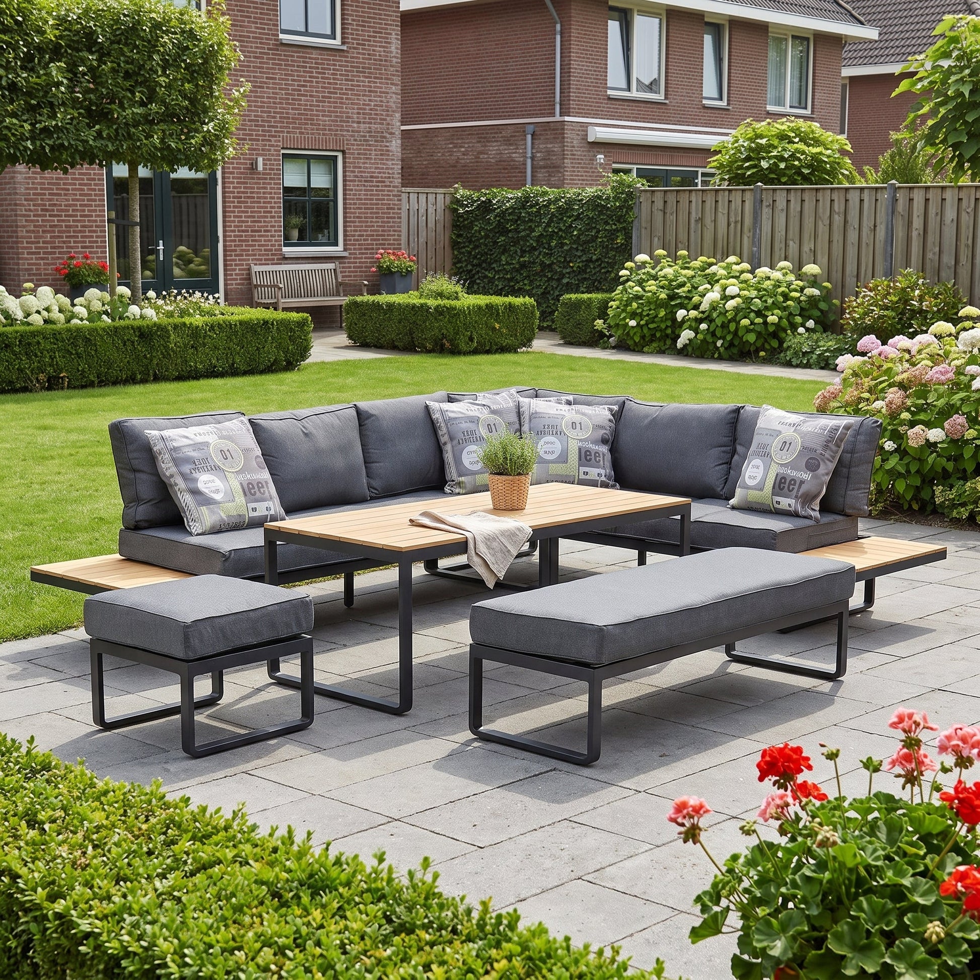 Dallas Hoek Loungeset - Dark Grey / Rechts in een sfeervolle tuin - Outnest tuinmeubelen
